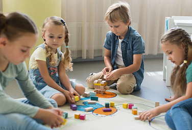 front_view_children_playing_together_kindergarten-_1_