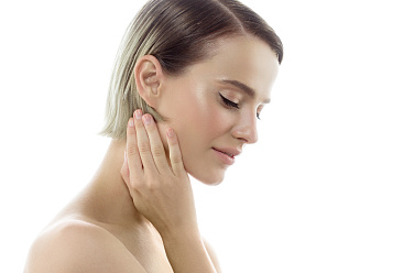 woman_with_healthy_fresh_skin_isolated_white_hand_touching_face_beauty_spa_concept_1_